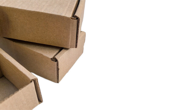 Craft cardboard tuck top boxes with ears cropped along left border on isolated white background.