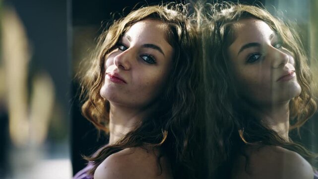 Young green eyed woman sensualy look at camera with reflection on glass window