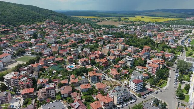 Aerial pull back over the rooftops of Obzor town, Bulgaria