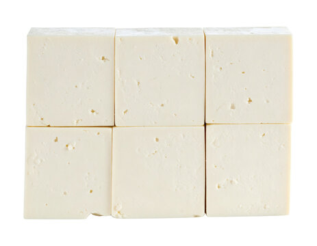 Feta cheese cubes arranged in a neat grid pattern showing organic texture and creamy white color&nbsp;