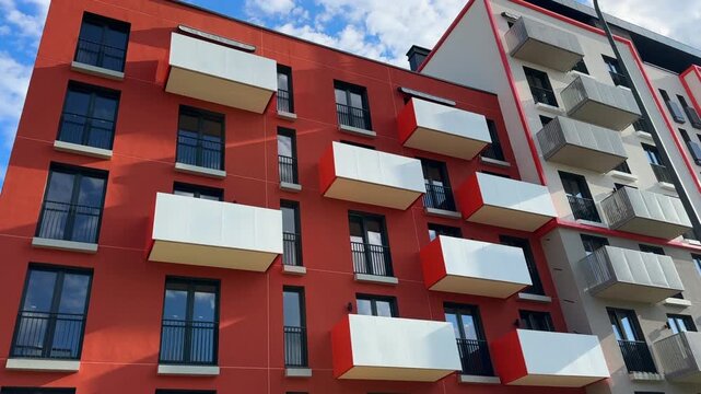 Condo building exterior. Facade building exterior. Residential condo block. Multifamily building with glass windows, balconies. Buildings architecture. Facade of condominium block in Europe.