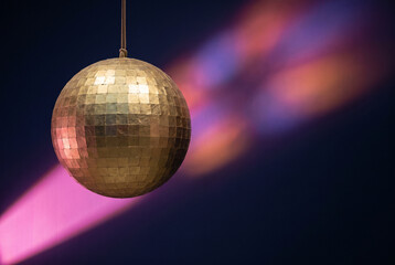 Fototapeta premium Mirrorball disco ball with colorful light beam for nightlife and party design
