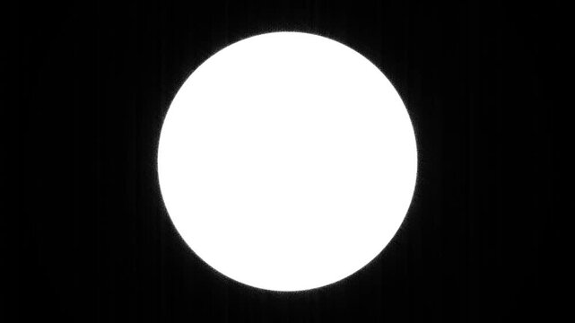 Minimalist graphic element featuring a glowing white circle isolated against a deep solid black background