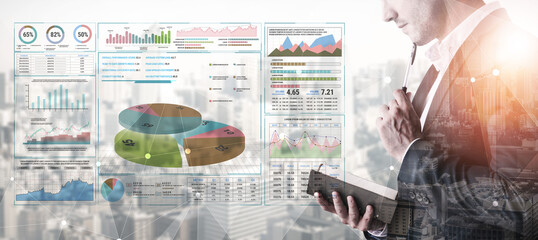 Business Professional Analyzing Data and Graphs for Strategic Decision Making in Modern Office...