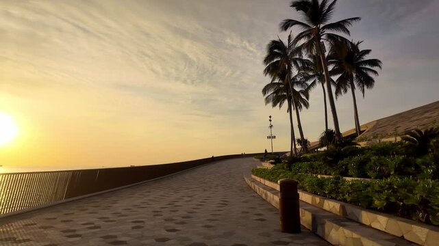 Sunset Promenade Walkway with Palm Trees in Sunset Town, Phu Quoc Vietnam 