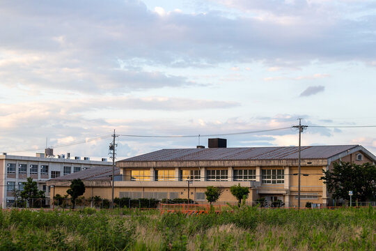 School building exterior illuminated at dusk