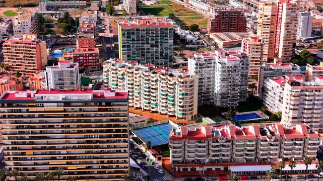 Apartment buildings in Castellon, Valencia. High angle shot of residential architecture, dense urban blocks and swimming pools.