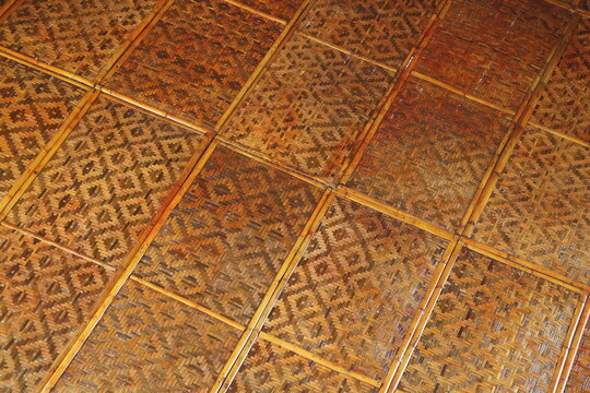 Traditional bamboo woven flooring and ceiling showcasing natural texture, sustainable design, and rustic craftsmanship.
