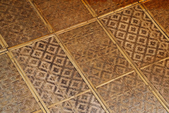 Traditional bamboo woven flooring and ceiling showcasing natural texture, sustainable design, and rustic craftsmanship.
