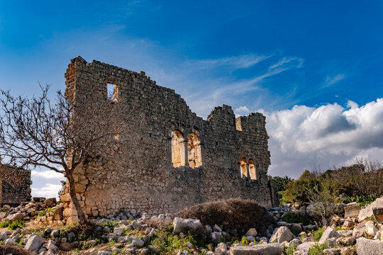 Archaeological site features weathered stone ruins. The quiet endurance of ancient architecture within a rugged landscape. Turkey, Mersin