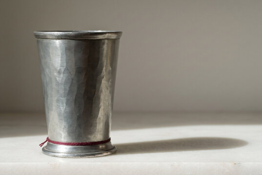 Pewter Cup with Soft Shadow on Minimal Neutral Background