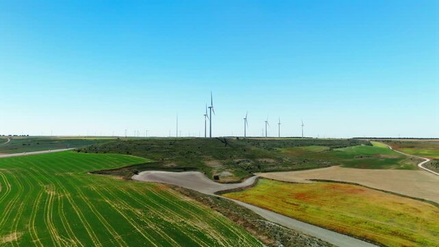 Wind turbines across rolling farmland near Avila Spain