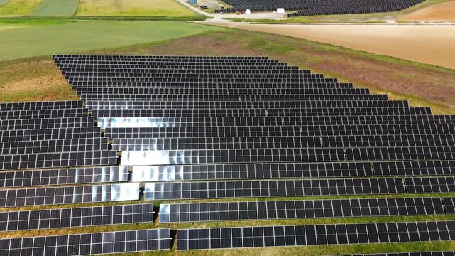 Sun glare moving across solar array in Avila Spain