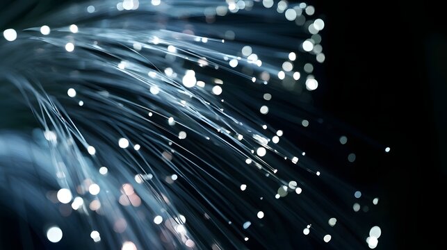 Fibrous strands of light radiate from a dark background  creating a dynamic and futuristic visual effect with glowing points along their paths