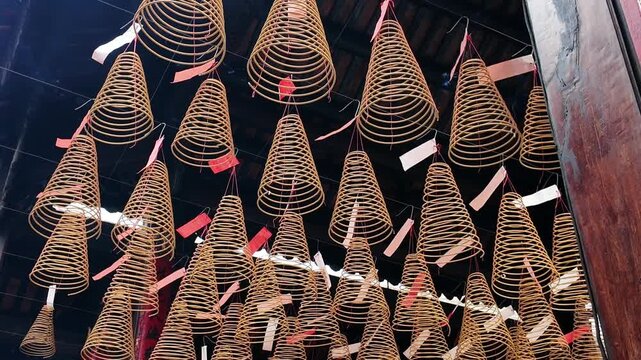 Hanging burning incense coils inside a traditional Chinese temple in Cholon, District 5, Ho Chi Minh City, Vietnam