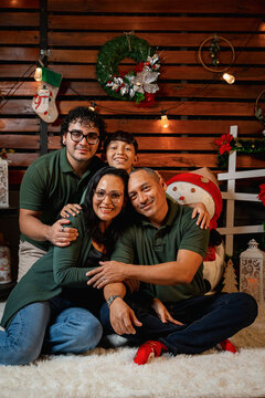 Family celebrating christmas holidays together posing for a portrait