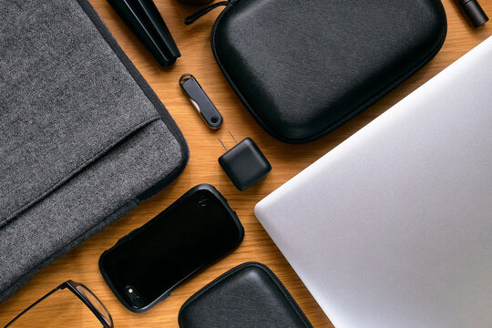 USB Charger with Gadgets on Wooden Table