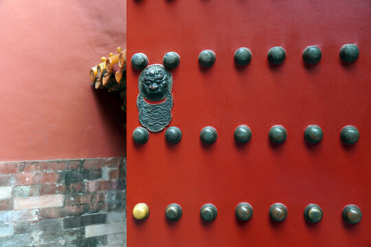 Red Chinese Gate with Traditional Door Knocker