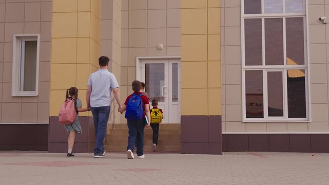 Kids in colorful backpacks, Mother and father escorting children, Early morning sunlight, Lush green bushes by the path, Modern school architecture, Family bonding time, Students beginning education