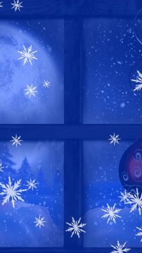 Animation of snow falling over christmas baubles decoration and winter scenery