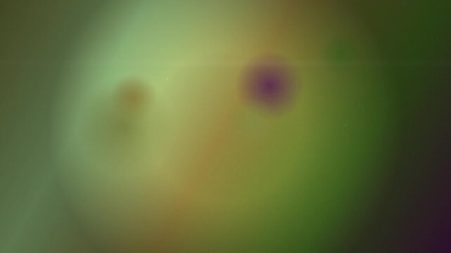 Soft glowing orbs float in a dreamy green and yellow gradient background.