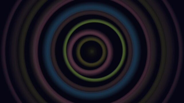 Glowing concentric rings of blue and green spiral inward to create a hypnotic abstract tunnel effect against a dark background.