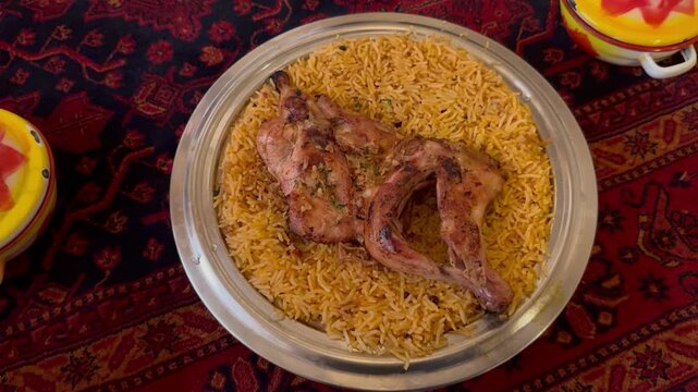 Traditional Arabian Grilled Chicken Madbi with Kabsa Rice Served on Platter