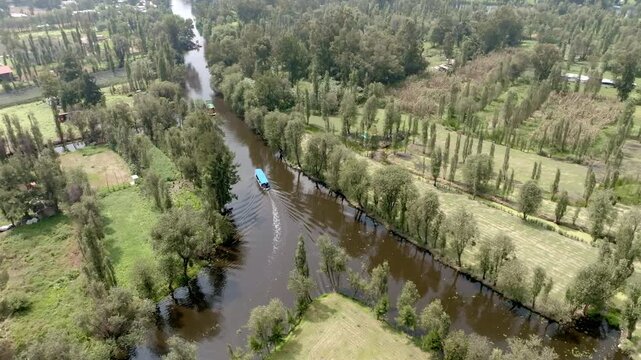 Aerial view of colorful trajineras boats and canals on a pier in Xochimilco in Mexico City