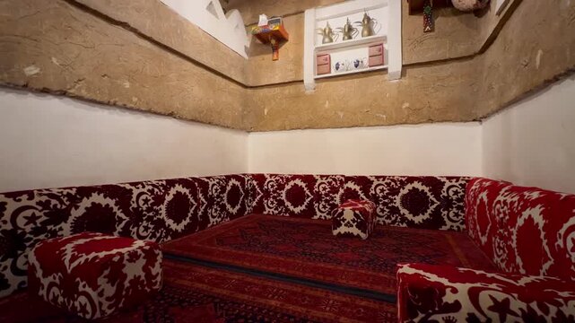 Traditional Saudi Heritage Room Interior with Clay Mud Walls and Majlis Seating