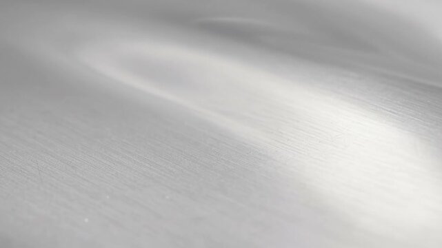 Abstract silver metallic surface with smooth texture and soft highlights for modern design background