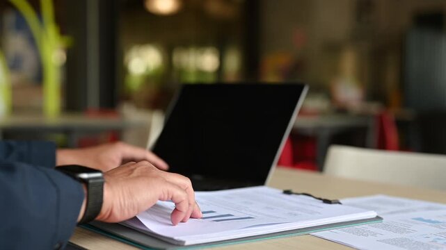 Business analyst performing data analysis, conducting market research, reviewing financial report, executing strategic analysis, completing deeper research before finalizing performance analysis.