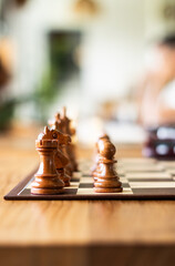 Chess game with chess pieces on a chessboard. Strategic board game concept representing intelligence, planning, competition, tactics and logical thinking. © mahmoud