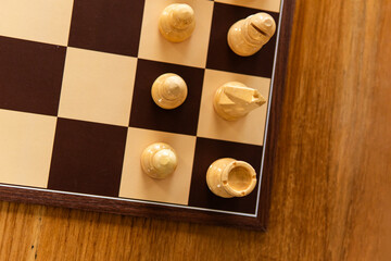 Chess game with chess pieces on a chessboard. Strategic board game concept representing intelligence, planning, competition, tactics and logical thinking. © mahmoud