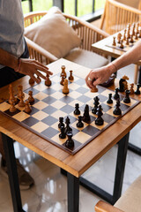 Chess game with chess pieces on a chessboard. Strategic board game concept representing intelligence, planning, competition, tactics and logical thinking. © mahmoud