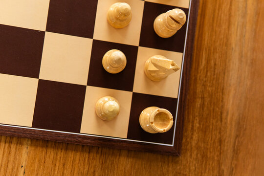 Chess game with chess pieces on a chessboard. Strategic board game concept representing intelligence, planning, competition, tactics and logical thinking.