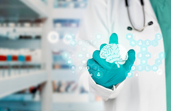 Technology in neurological healthcare and medical tools for the prevention of neurodegenerative diseases. The doctor displays the brain symbol. Isolated with a bokeh background.