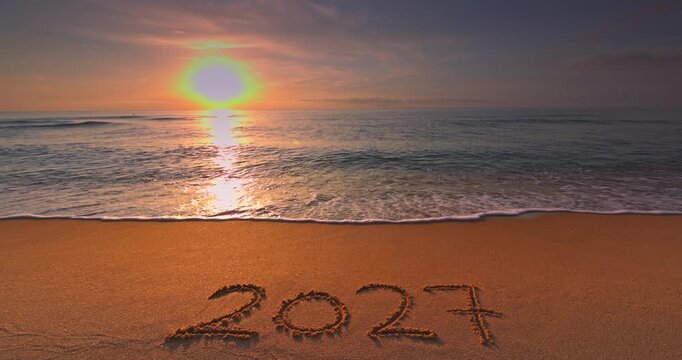 Golden Sea Sunrise, Ocean Beach Shore with text 2027 on the sandy shore
