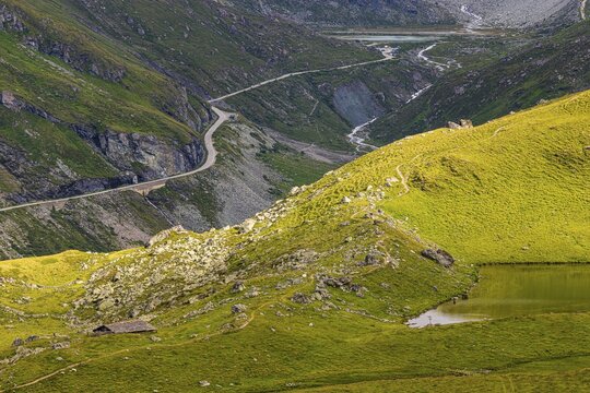A pass road leads to the Moiry glacial lake, above Grimentz, Val d'Anniviers, Valais Alps, Canton Valais, Switzerland