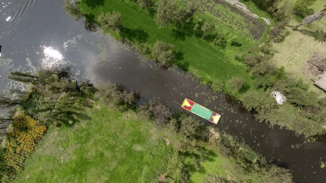 Aerial view of colorful trajineras boats and canals on a pier in Xochimilco in Mexico City