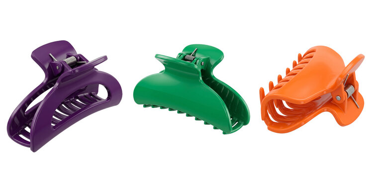 Plastic hair claw clips in assorted bright colors on&nbsp;transparent&nbsp;background