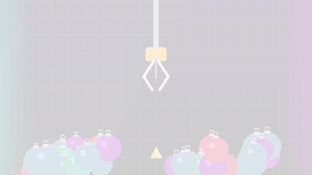 Arcade claw machine picking up christmas bauble for holiday sale