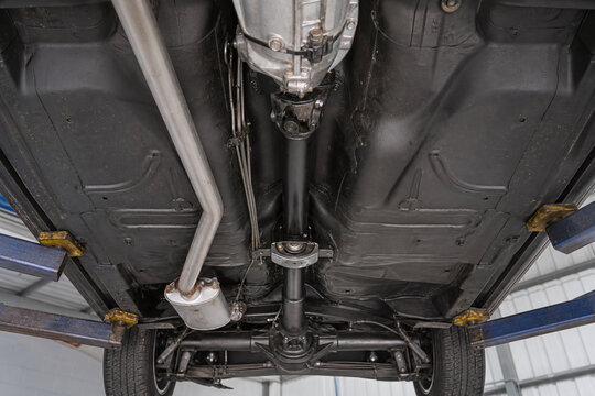 Underbody rear drive floorpan with driveshaft and axle