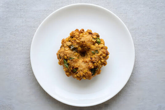 Traditional crispy South Asian lentil vade (Parippu Vada) on a plate