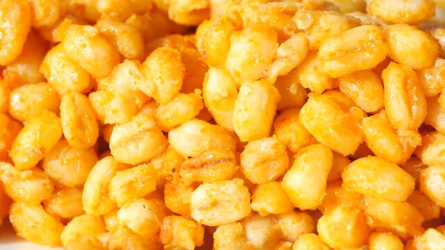 A close up view of delicious fried corn nuts, crispy crunchy salty snack, tasty and appetizing meal for healthy diet, traditional food from different cultures around the world