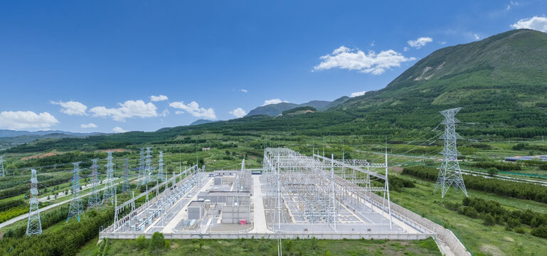Aerial View of High Voltage Electrical Power Substation in Mountain Valley