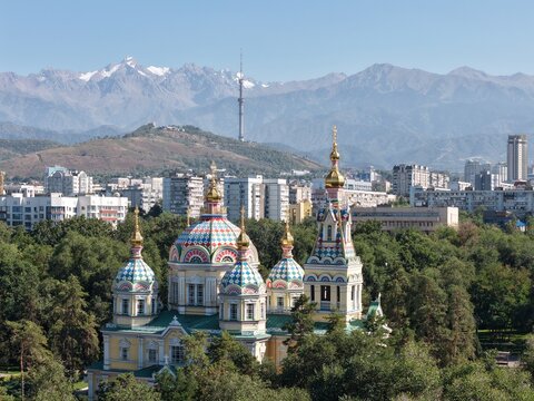 Almaty cityscape with Kok Tobe TV tower, Ascension Cathedral and snow-capped Trans-Ili Alatau mountains, Kazakhstan. g.