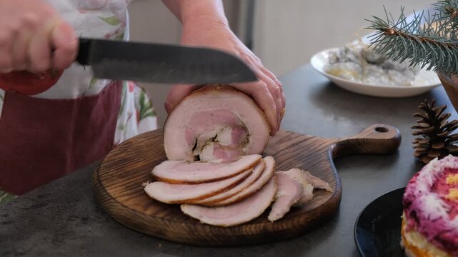 Baked pork belly. The cutting process. Preparing for the holiday. Christmas.