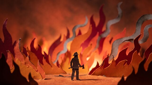 Paper-cut silhouette of a firefighter battling intense forest fires and air pollution amidst orange flames and smoke.