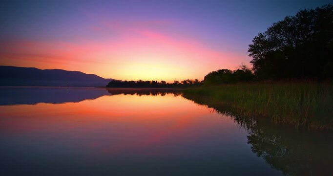  Fantastic colorful sunrise on lake Varese in Italy