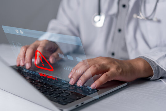 Healthcare Cybersecurity Warning on Laptop With Medical Professional and Digital Alert Interface for Data Security and System Risk